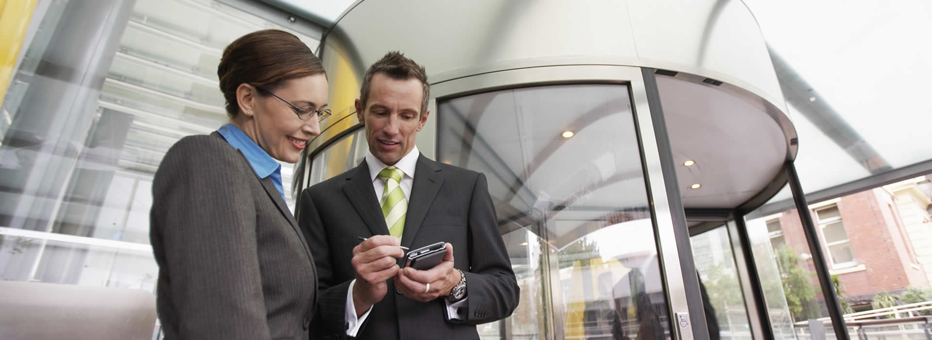 2 sales reps sending orders back to HQ from a PDA